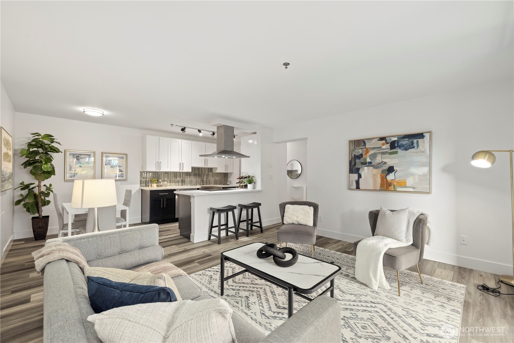 500 5th Avenue West, Unit 306 Seattle, WA 98119 - Photo 1 of 21 a living room with furniture and kitchen view