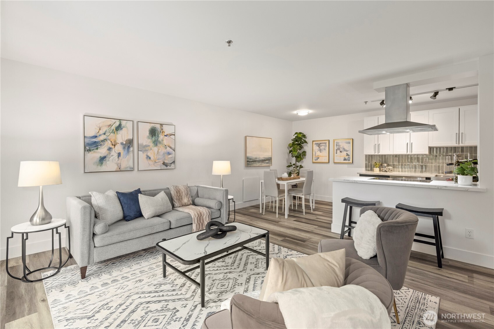 500 5th Avenue West, Unit 306 Seattle, WA 98119 - Photo 11 of 21 a living room with furniture a rug and kitchen view