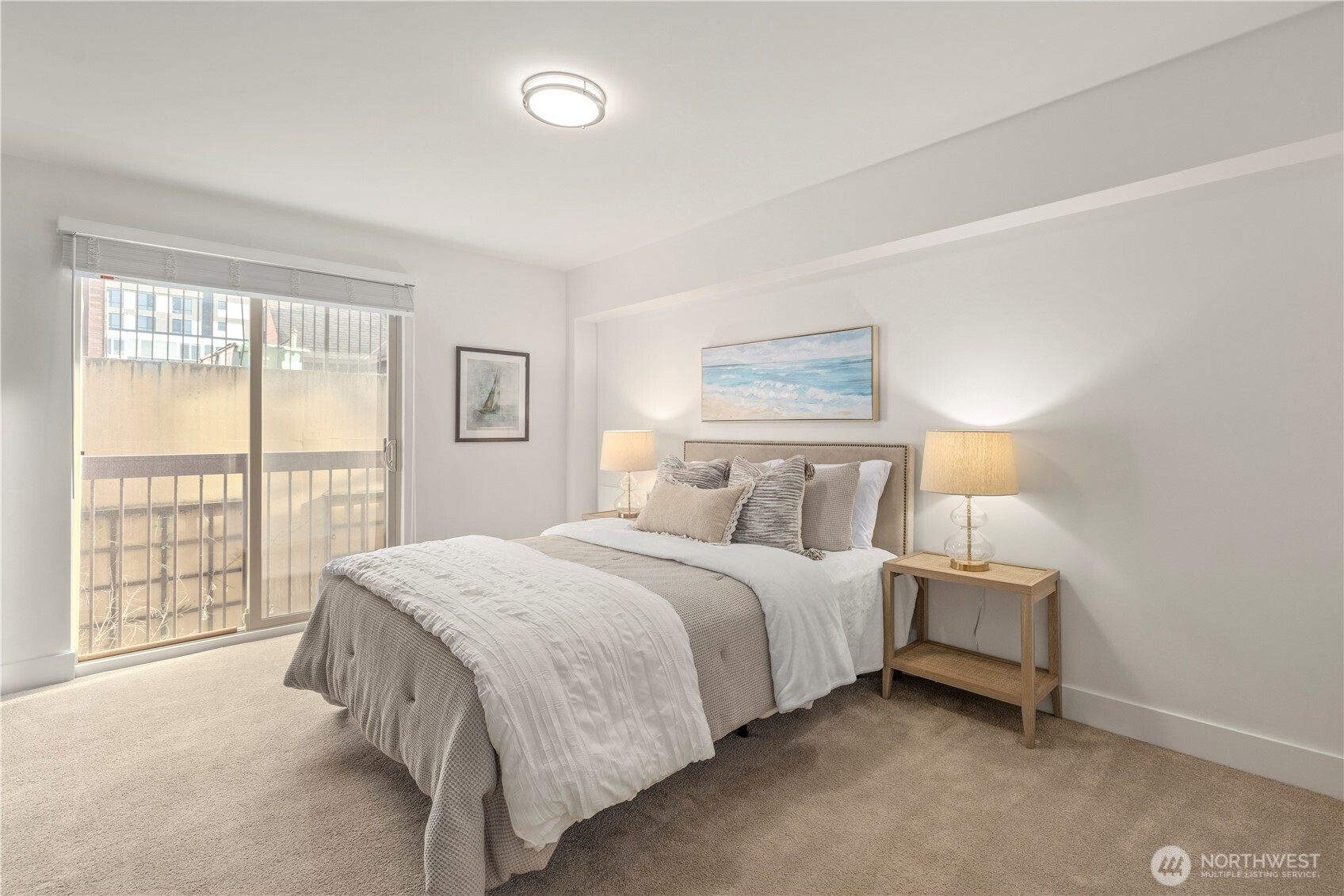 500 5th Avenue West, Unit 306 Seattle, WA 98119 - Photo 12 of 21 a bedroom with a bed and a night stand