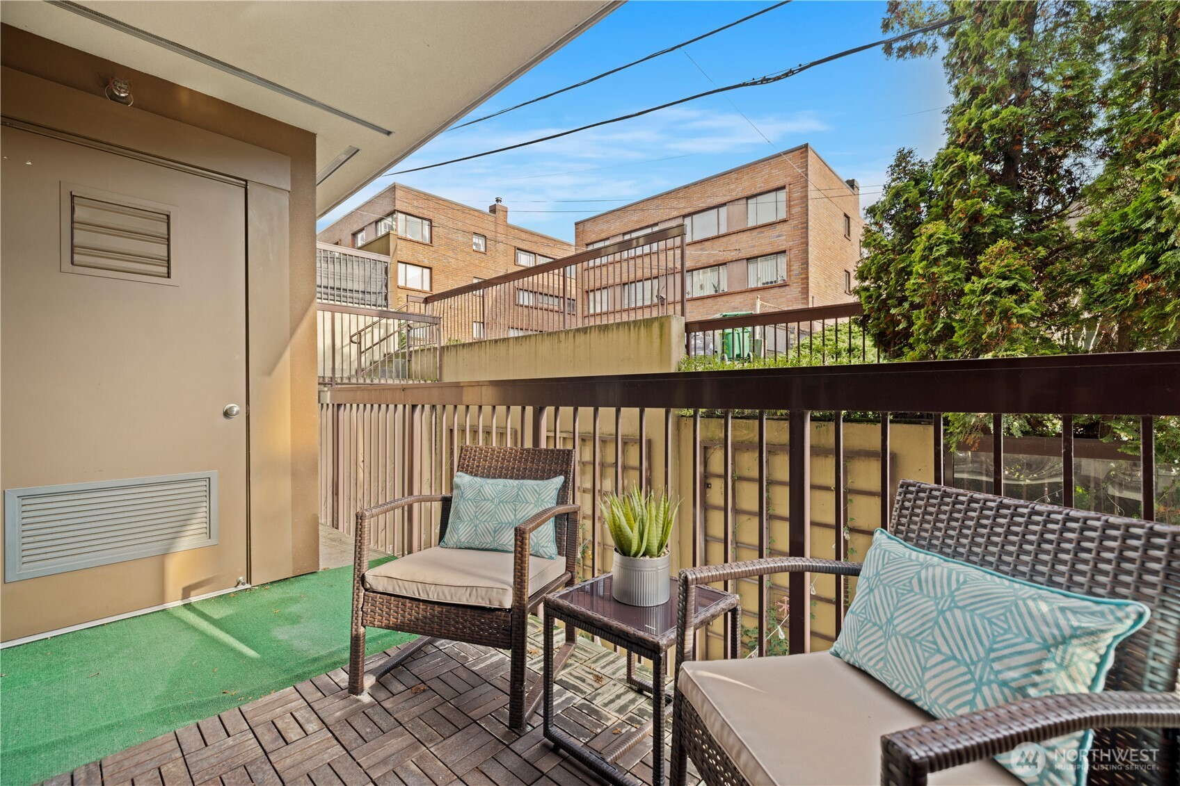 500 5th Avenue West, Unit 306 Seattle, WA 98119 - Photo 16 of 21 a view of a chairs and table in the patio