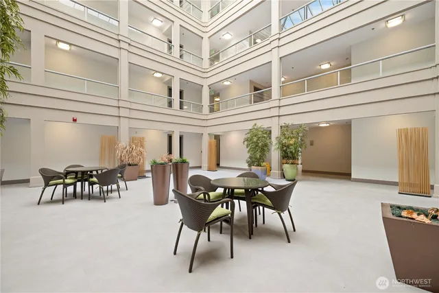 a view of a building with table and chairs