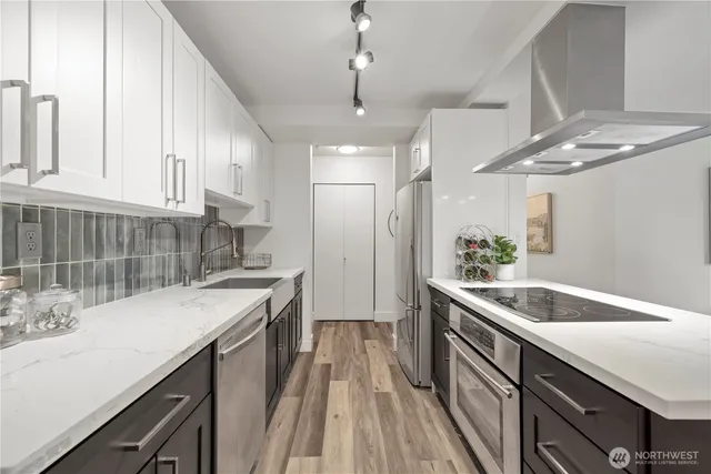 a kitchen with a sink and stove