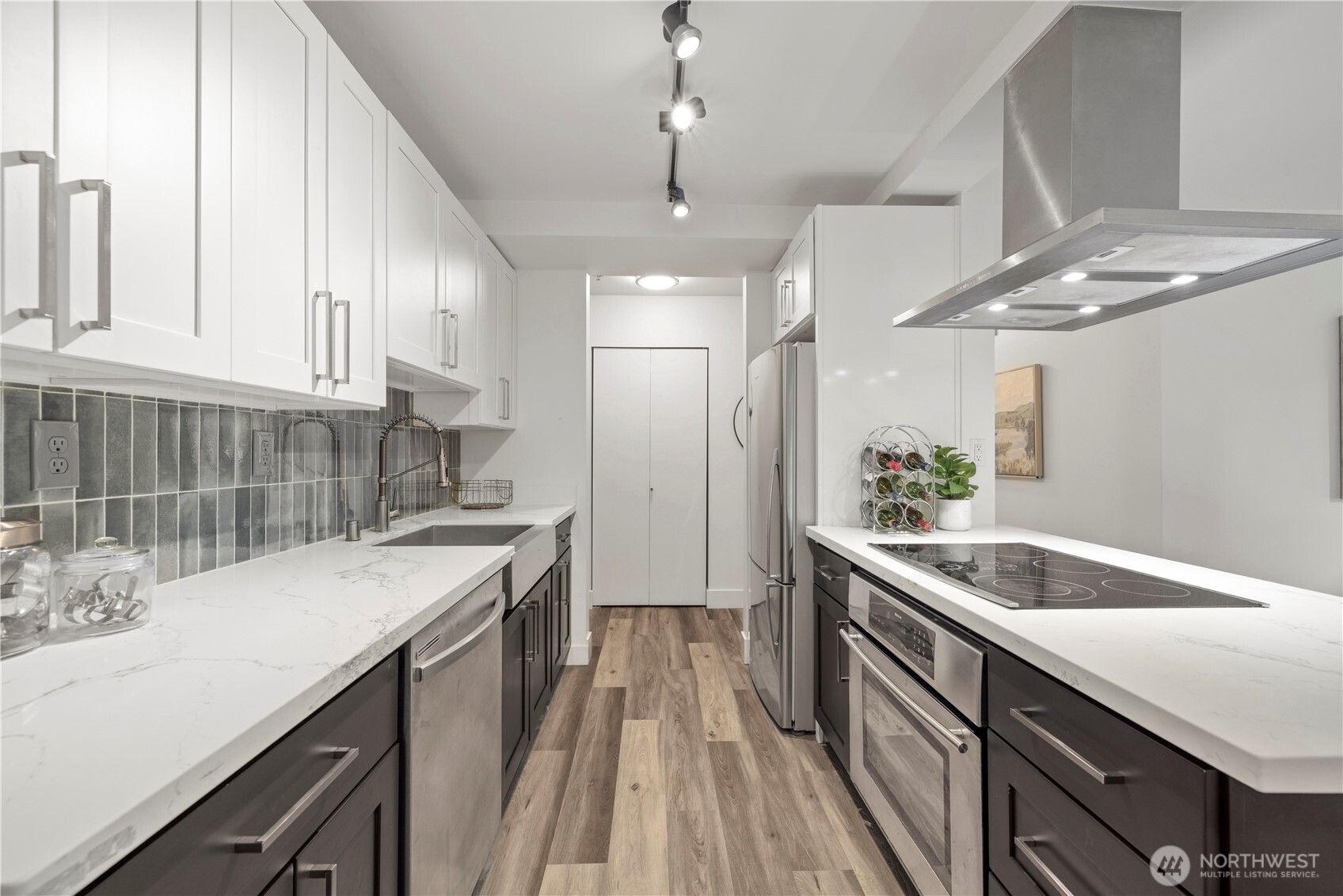 500 5th Avenue West, Unit 306 Seattle, WA 98119 - Photo 6 of 21 a kitchen with a sink and stove