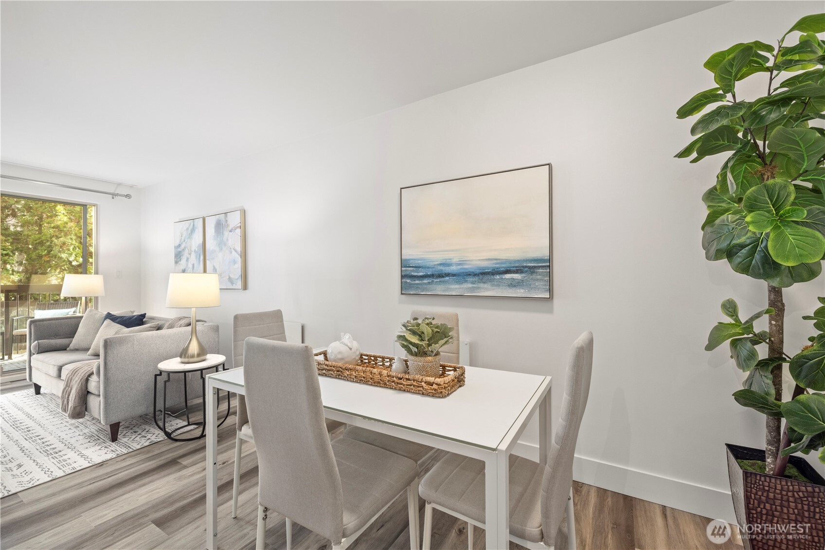 500 5th Avenue West, Unit 306 Seattle, WA 98119 - Photo 9 of 21 a view of a dining room with furniture window and wooden floor