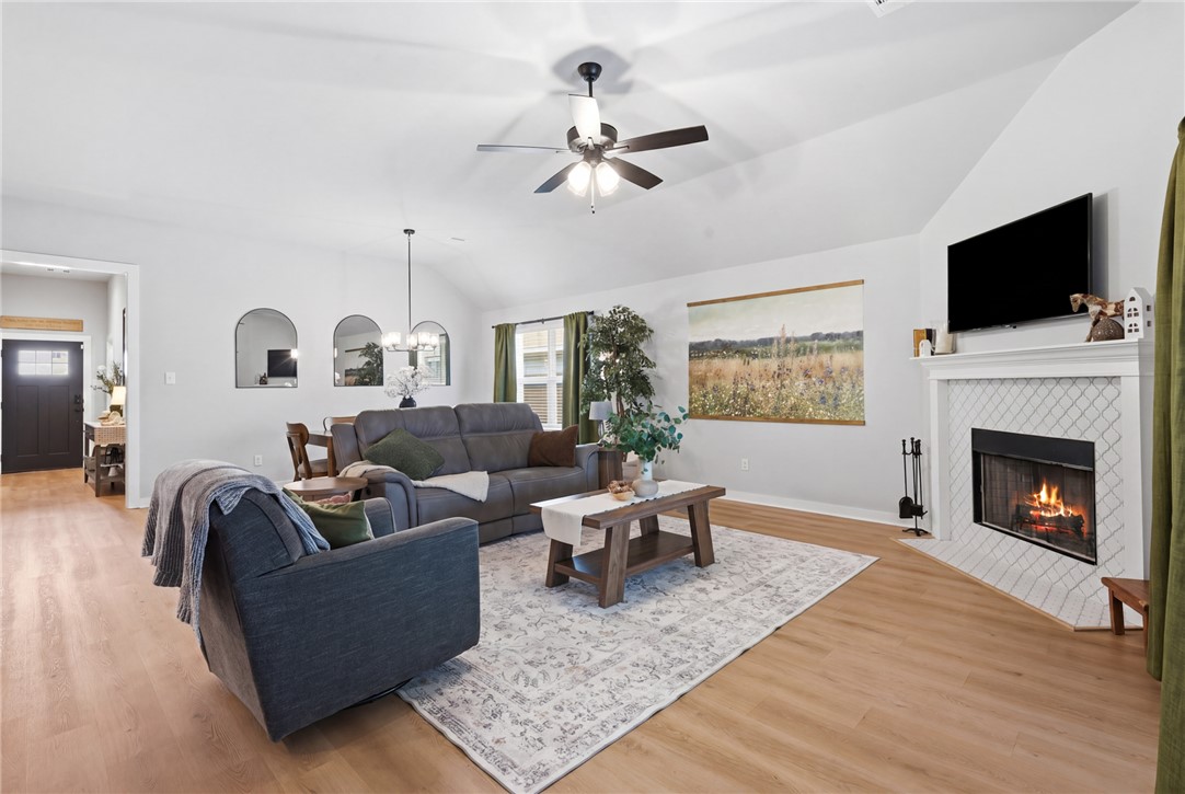 3112 Margaret Rudder Parkway Bryan, TX 77808 - Photo 5 of 24 a living room with furniture fireplace and flat screen tv