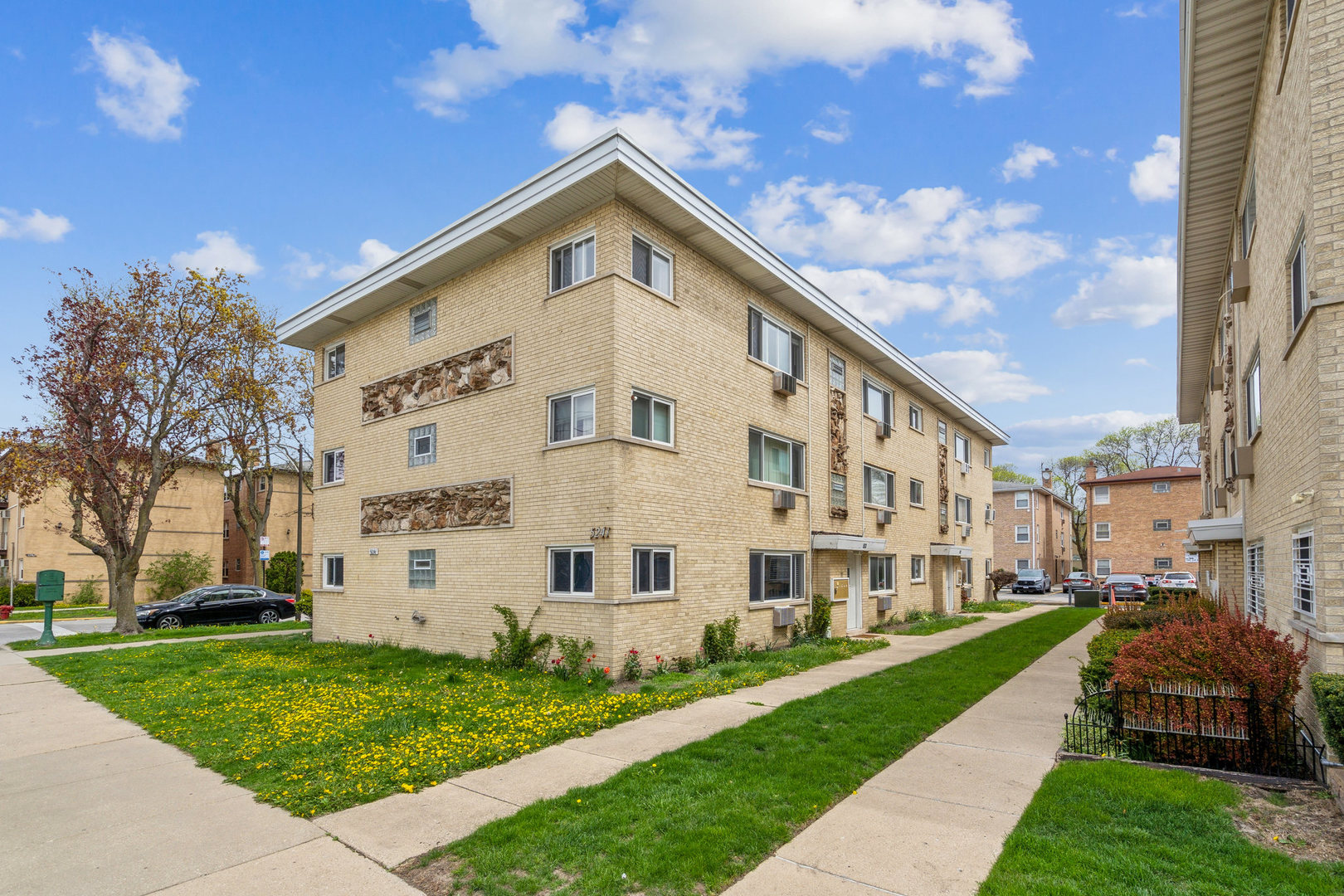 5241 North East River Road, Unit 3A Chicago, IL 60656 - Photo 1 of 1 a view of a white building among the yard