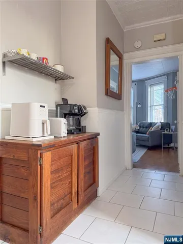 a kitchen view of a sink and a stove