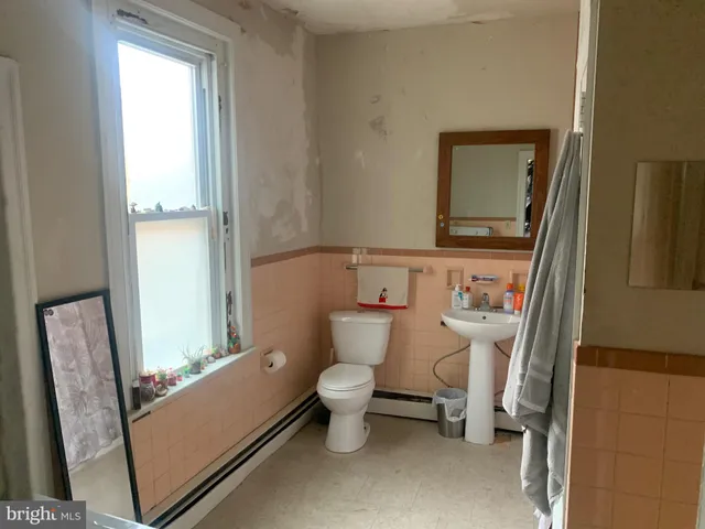 a bathroom with a toilet and a sink