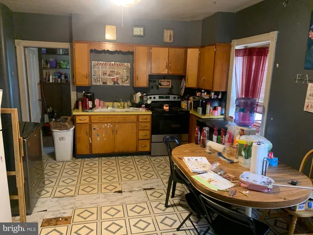 a room with chairs furniture and a window