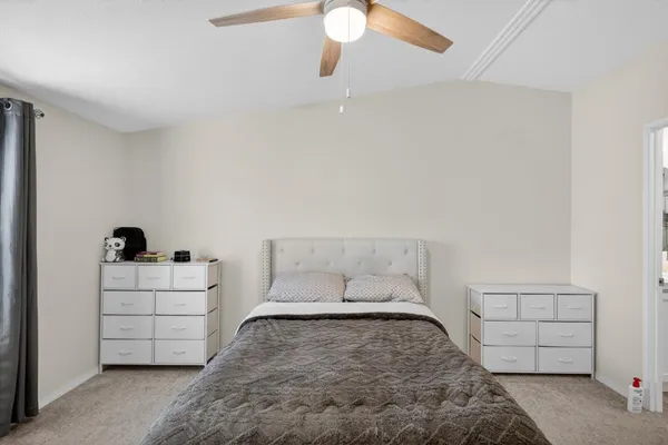 a bedroom with a bed and a cabinets