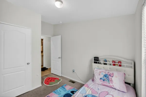 a room with toys and a dresser