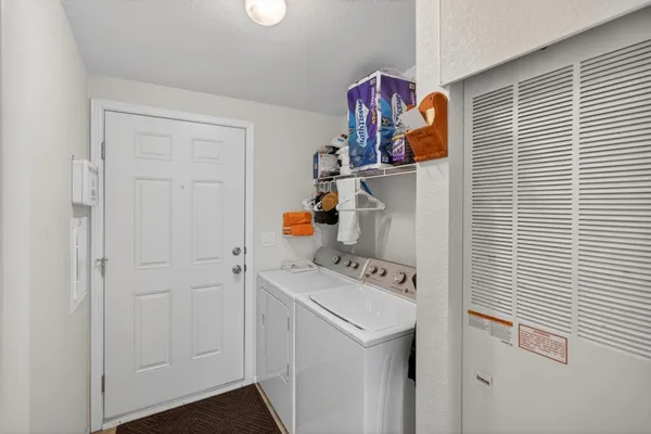 a utility room with dryer and washer