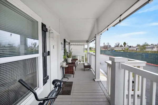 a view of a balcony with chairs