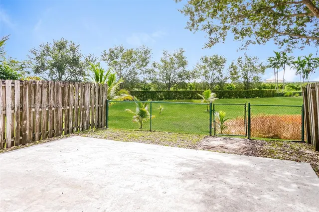 a view of lake with a big yard