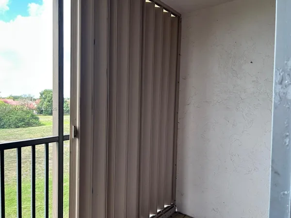 a view of a balcony with a swing