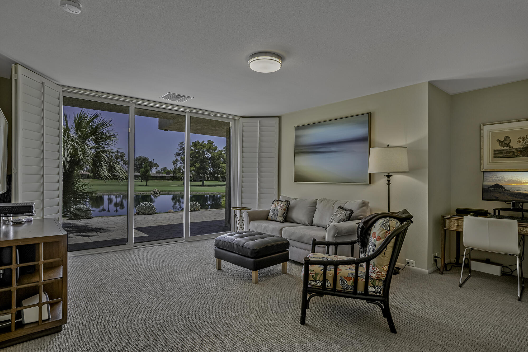 4 Stephens Court Rancho Mirage, CA 92270 - Photo 20 of 50 a living room with furniture and a floor to ceiling window