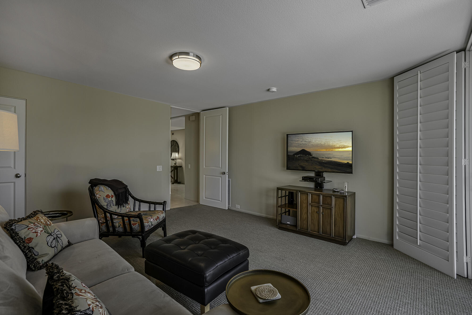 4 Stephens Court Rancho Mirage, CA 92270 - Photo 22 of 50 a living room with furniture and a flat screen tv