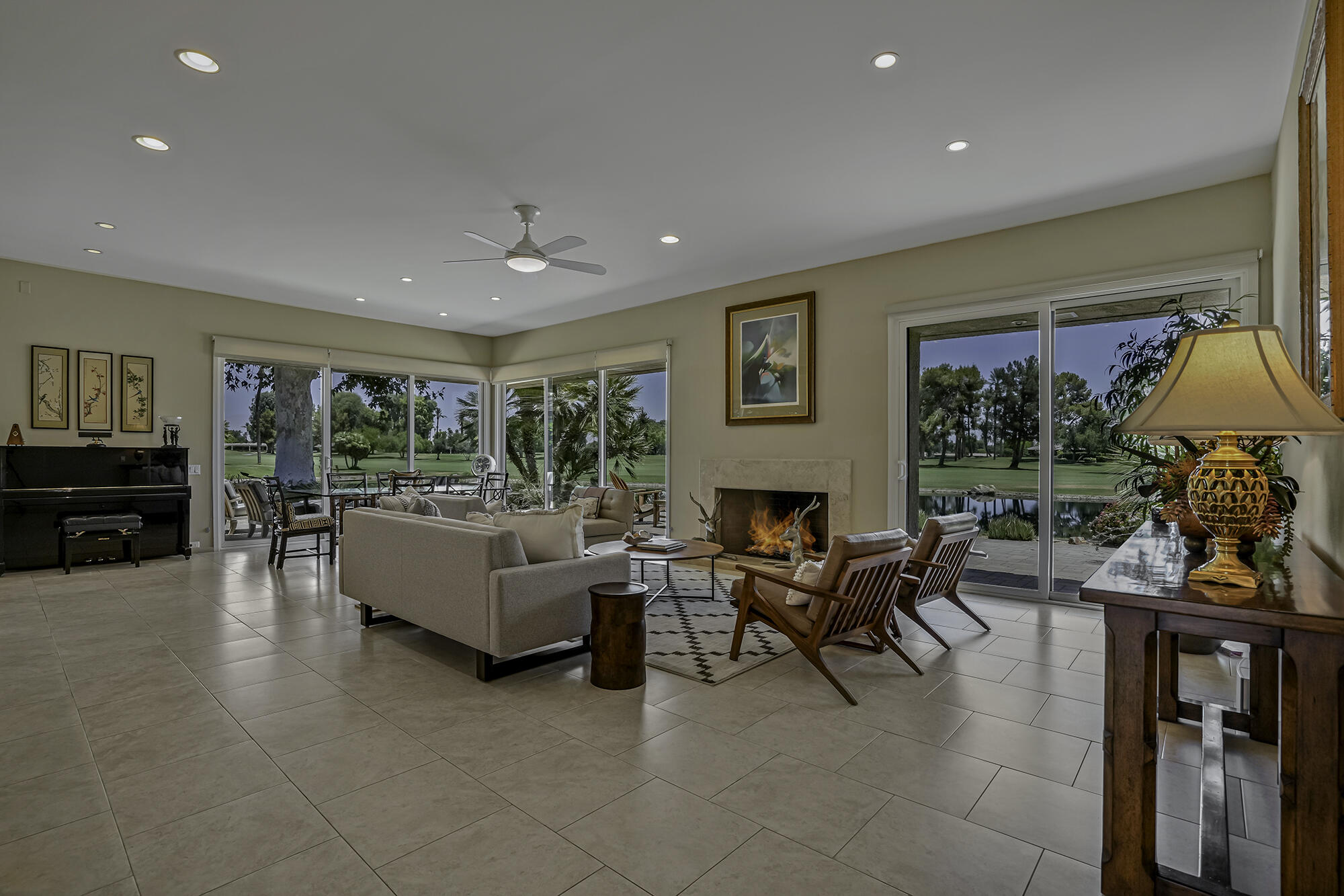 4 Stephens Court Rancho Mirage, CA 92270 - Photo 24 of 50 a living room with furniture a fireplace and a window
