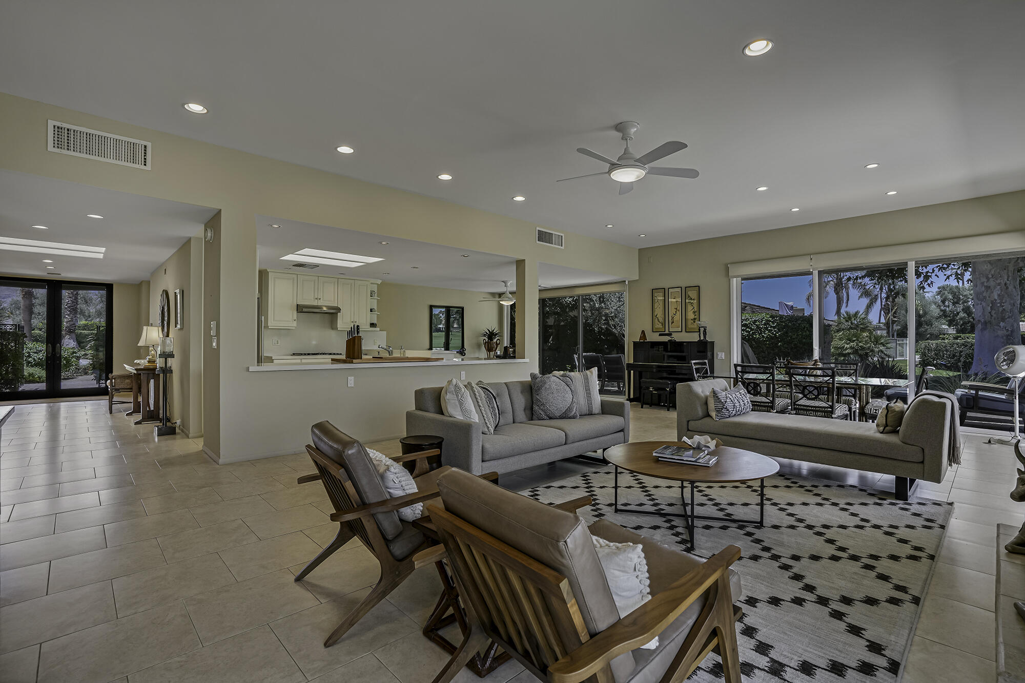 4 Stephens Court Rancho Mirage, CA 92270 - Photo 25 of 50 a living room with furniture and a large window