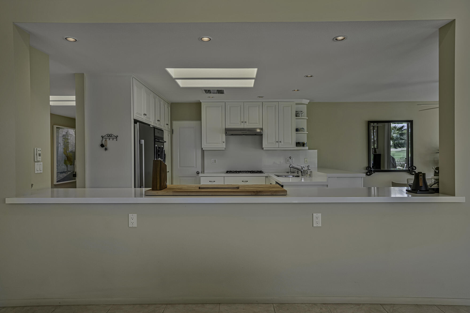 4 Stephens Court Rancho Mirage, CA 92270 - Photo 30 of 50 a view of a kitchen with kitchen island and stainless steel appliances