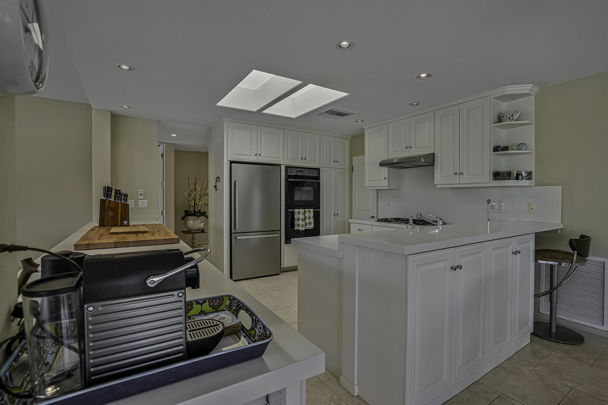 4 Stephens Court Rancho Mirage, CA 92270 - Photo 31 of 50 a kitchen with kitchen island a stove and a refrigerator