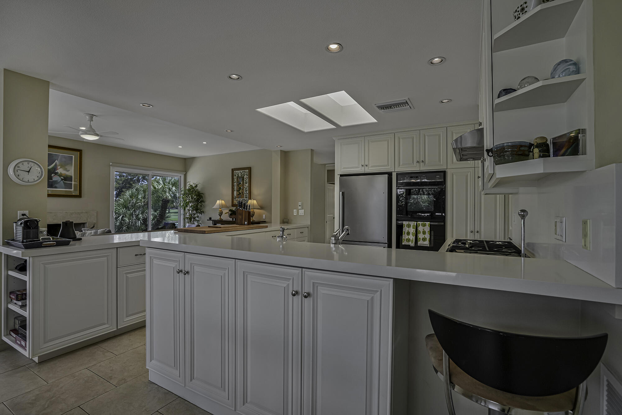 4 Stephens Court Rancho Mirage, CA 92270 - Photo 32 of 50 a kitchen with stainless steel appliances a sink cabinets and a window