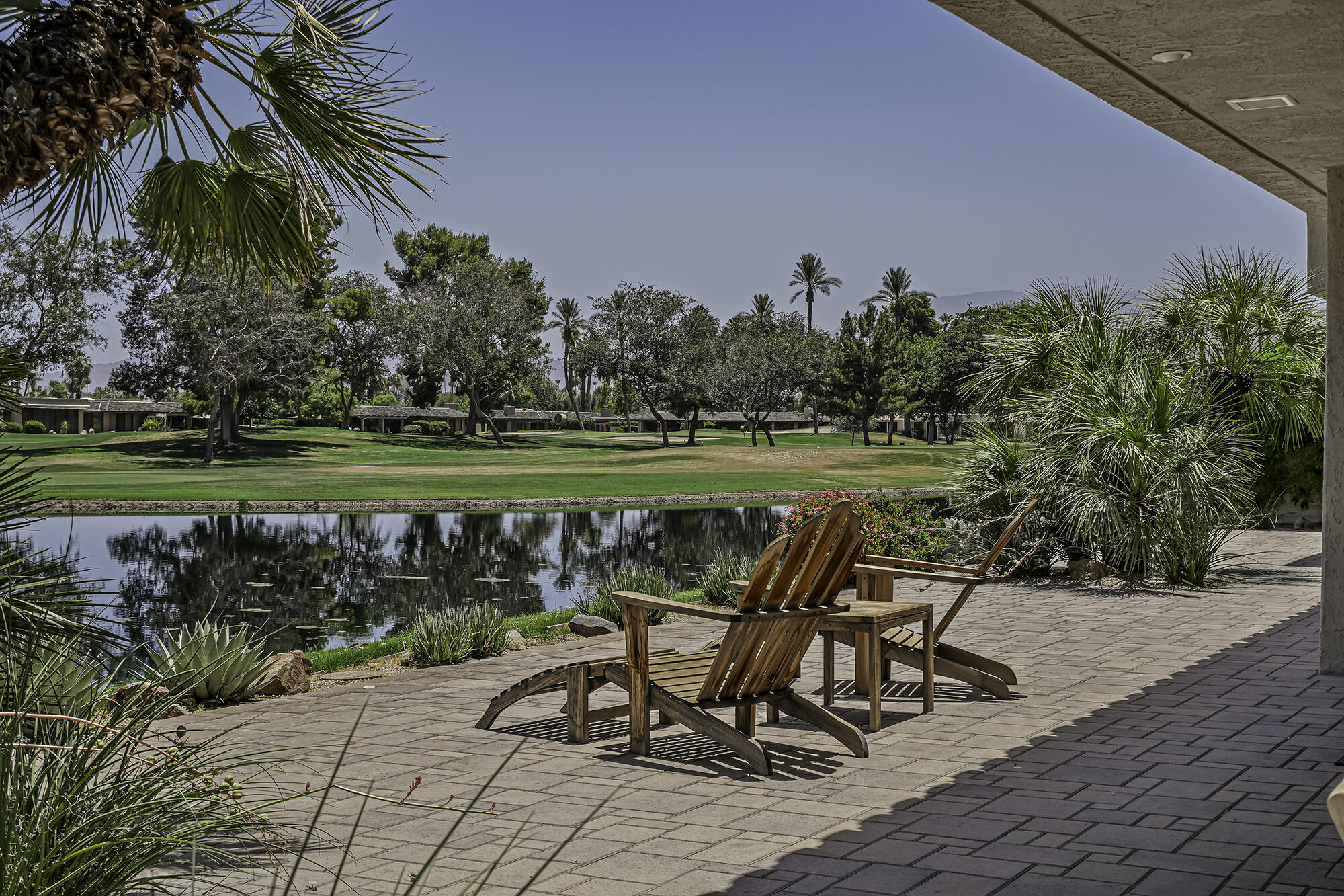 4 Stephens Court Rancho Mirage, CA 92270 - Photo 34 of 50 a view of a chair and table on the terrace