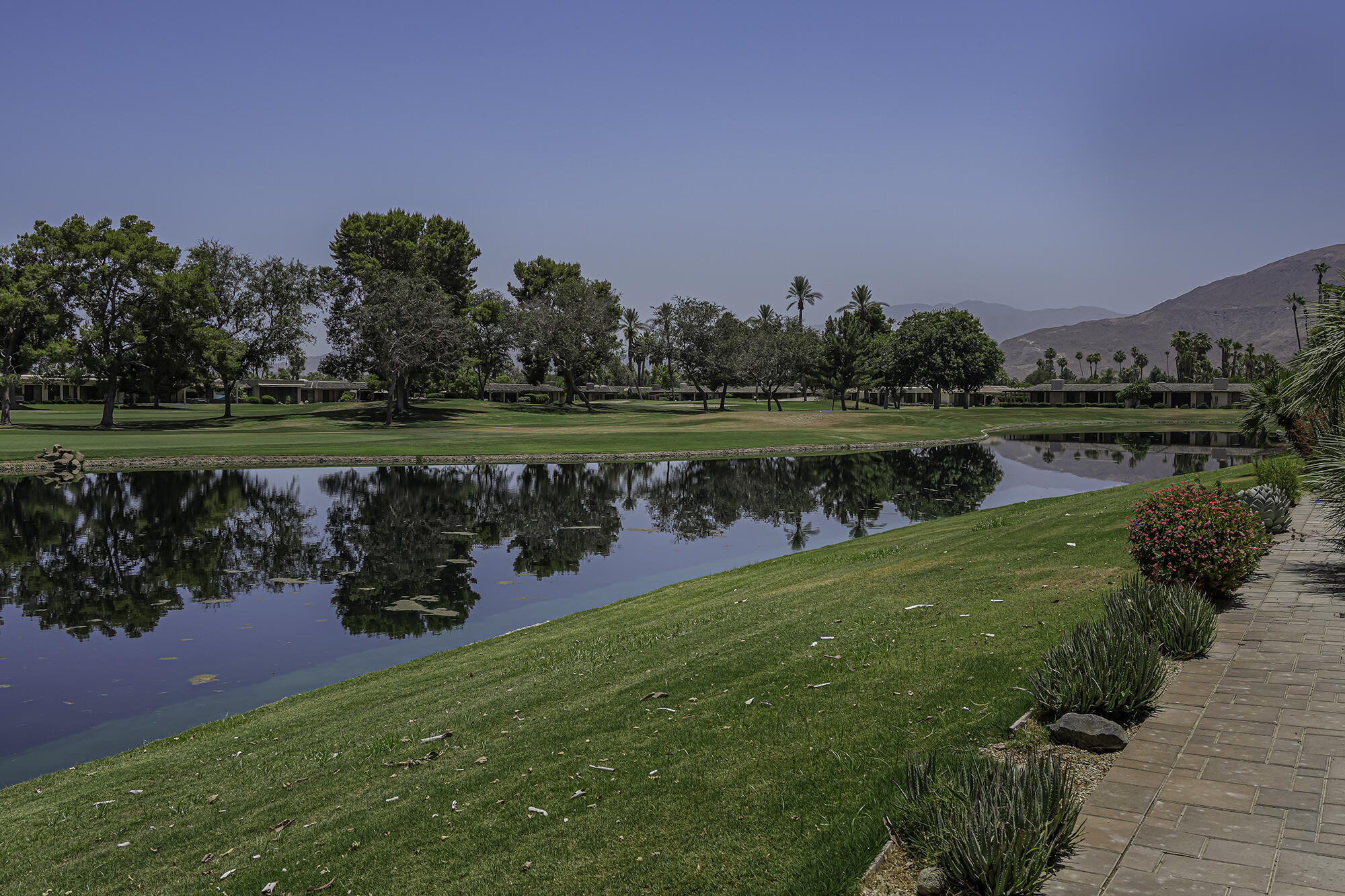 4 Stephens Court Rancho Mirage, CA 92270 - Photo 36 of 50 a view of a lake with a big yard