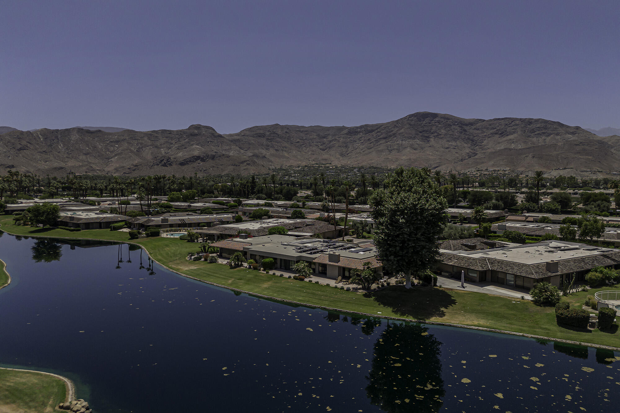 4 Stephens Court Rancho Mirage, CA 92270 - Photo 38 of 50 a view of a lake with mountains in the background
