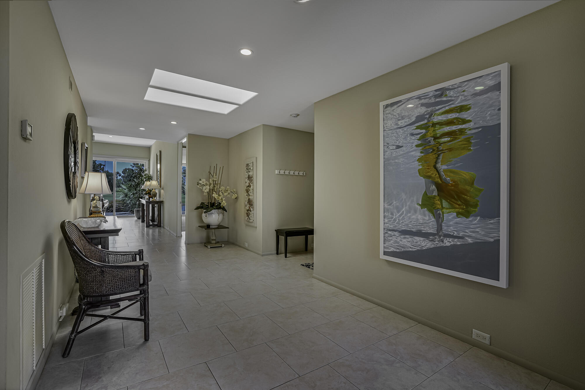 4 Stephens Court Rancho Mirage, CA 92270 - Photo 4 of 50 a living room with furniture and a painting on the wall