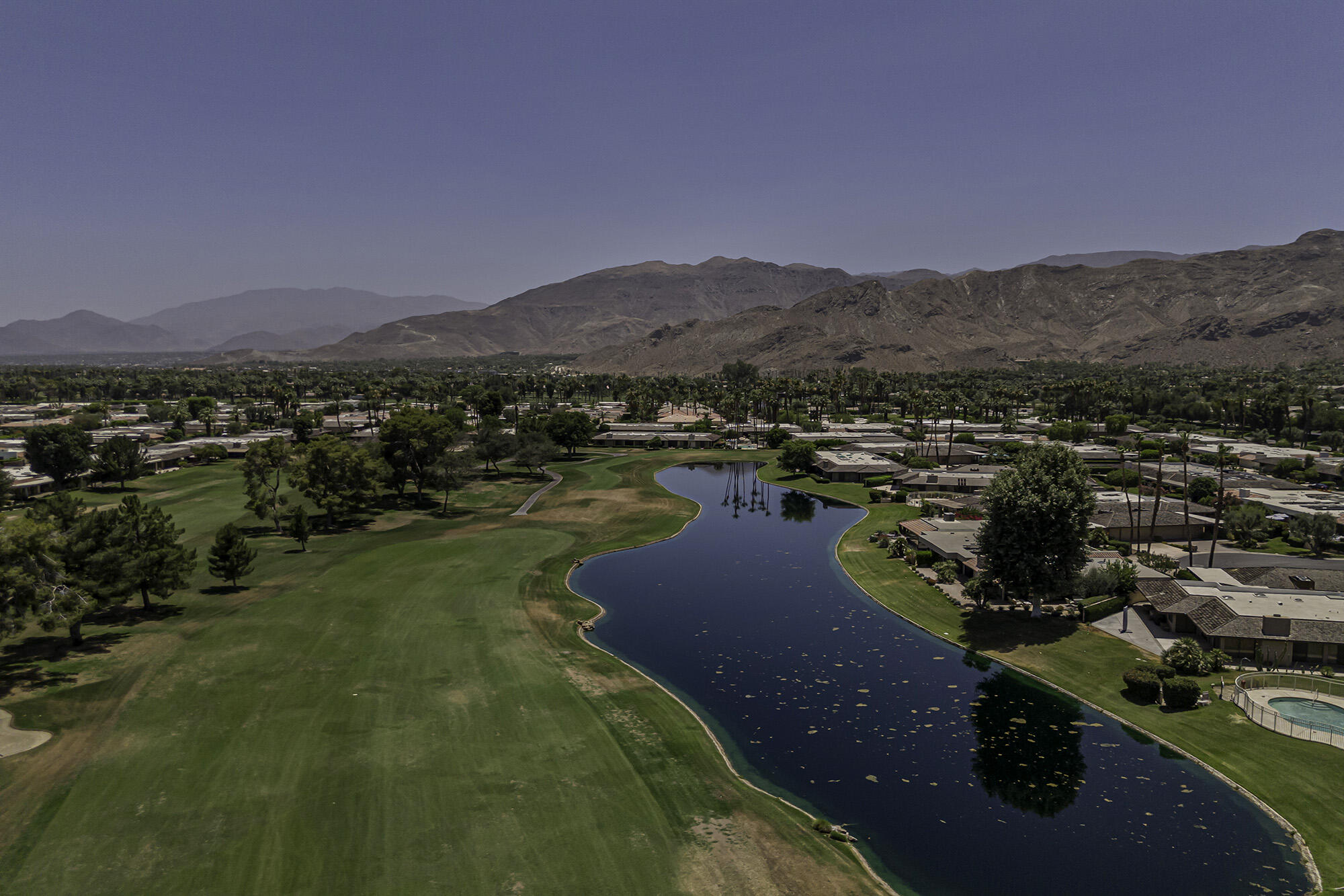 4 Stephens Court Rancho Mirage, CA 92270 - Photo 43 of 50 a view of a lake with mountains in the background
