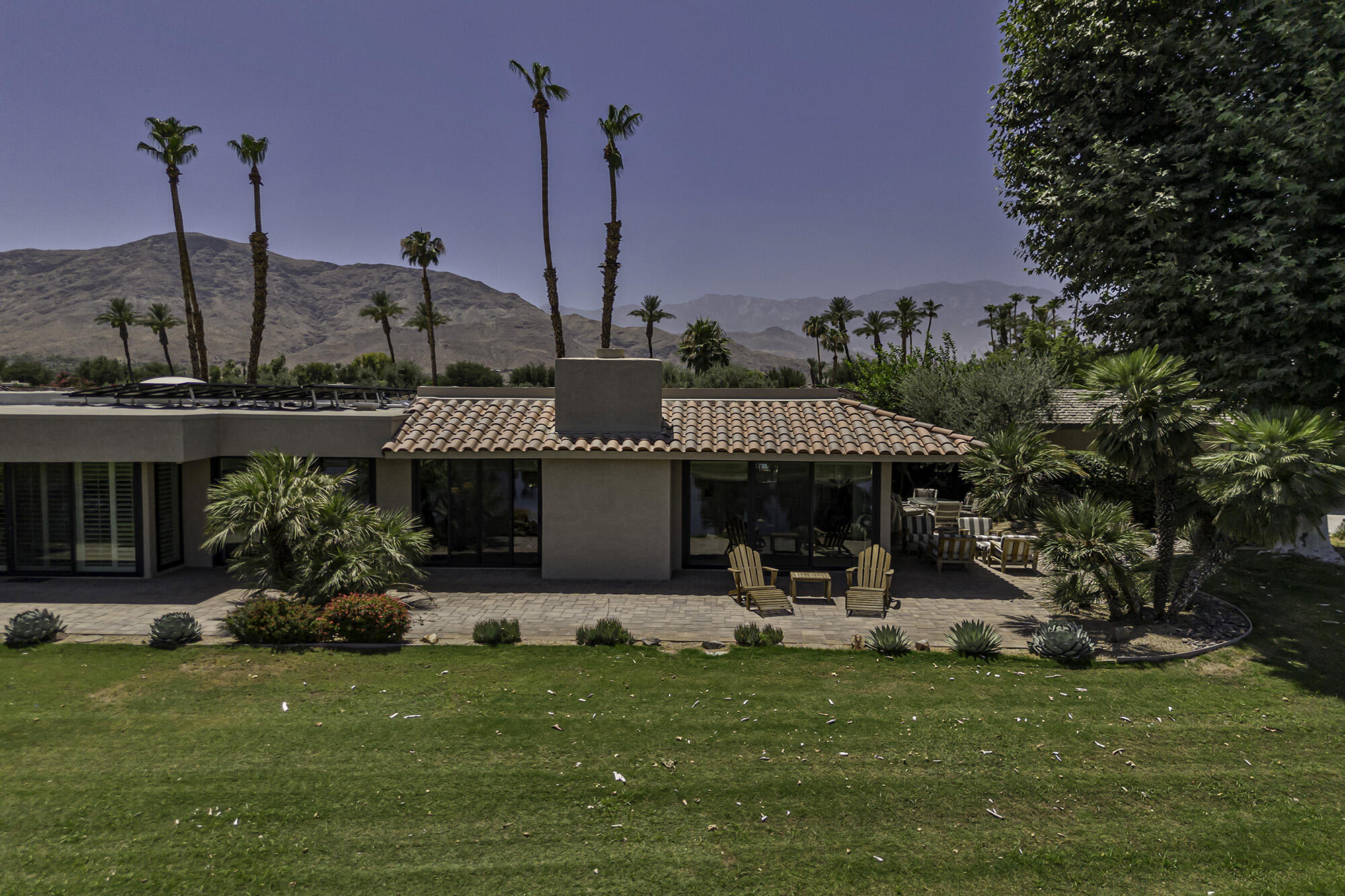 4 Stephens Court Rancho Mirage, CA 92270 - Photo 45 of 50 a front view of a house with garden