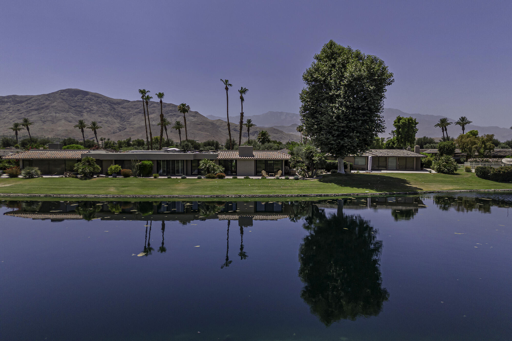 4 Stephens Court Rancho Mirage, CA 92270 - Photo 46 of 50 a view of a lake with a city