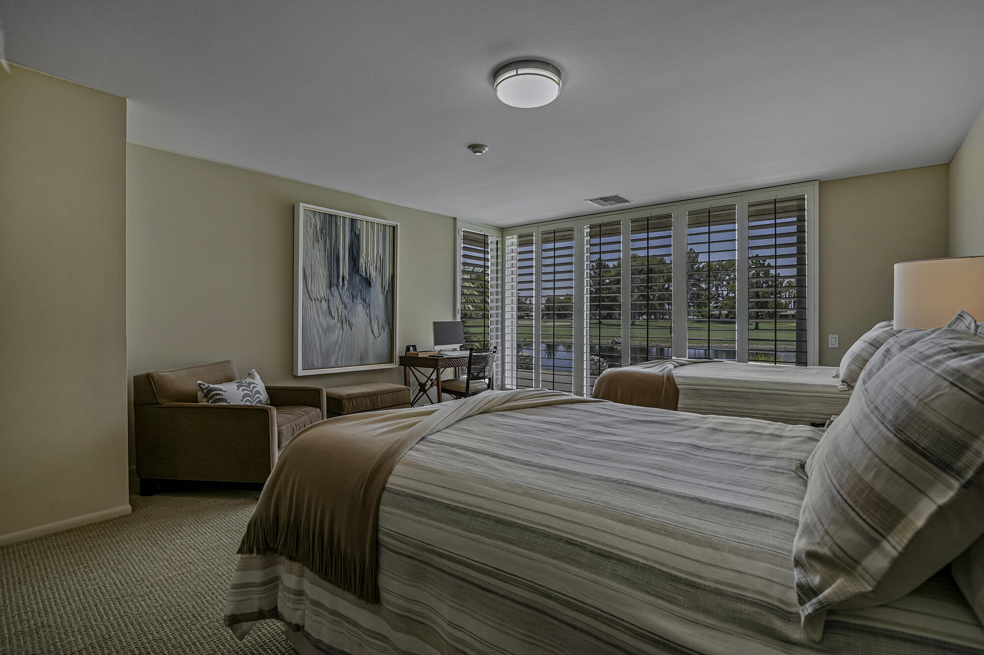 4 Stephens Court Rancho Mirage, CA 92270 - Photo 6 of 50 a bedroom with a bed and glass window