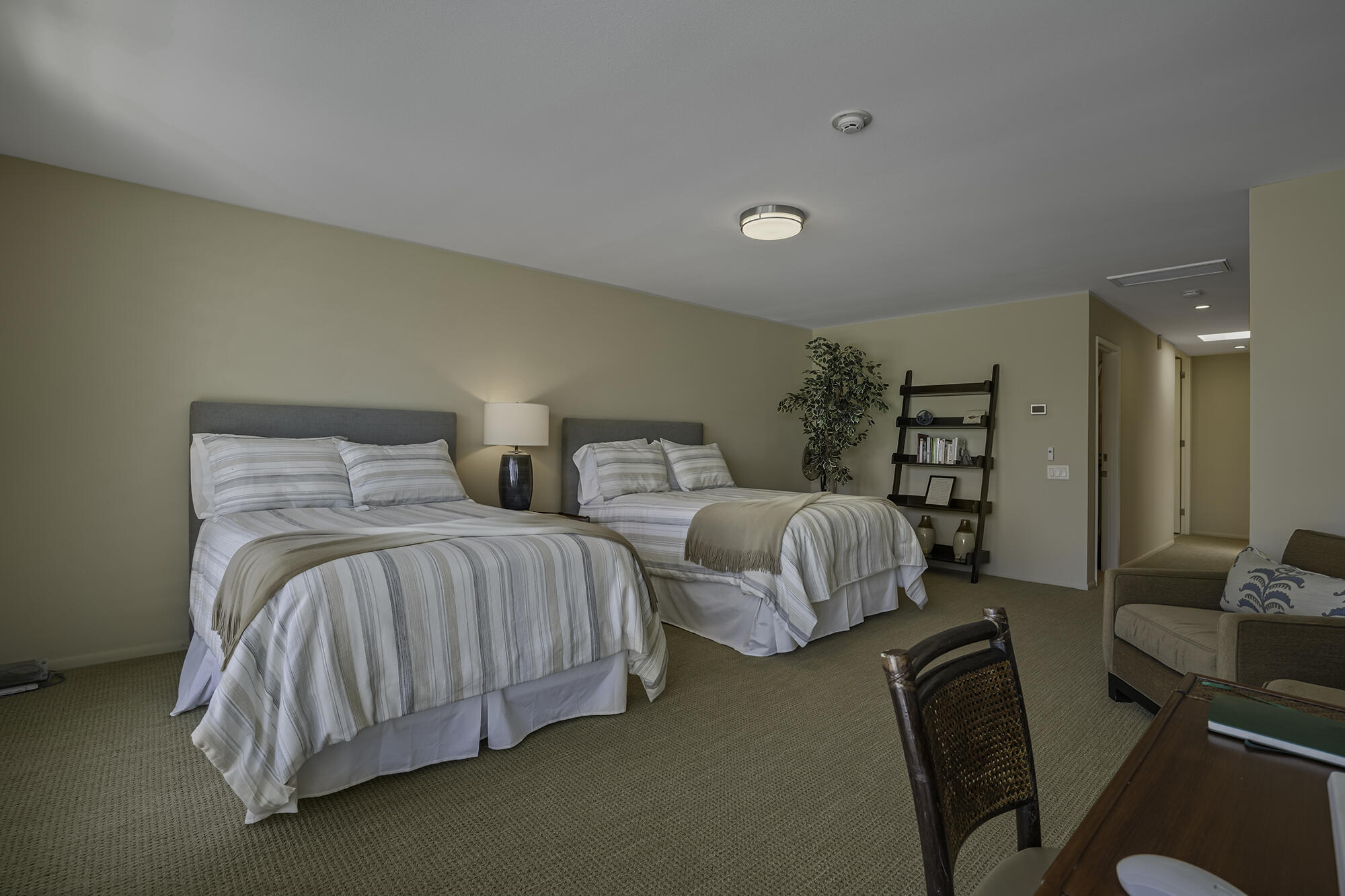 4 Stephens Court Rancho Mirage, CA 92270 - Photo 7 of 50 a bedroom with two beds and painting on the wall