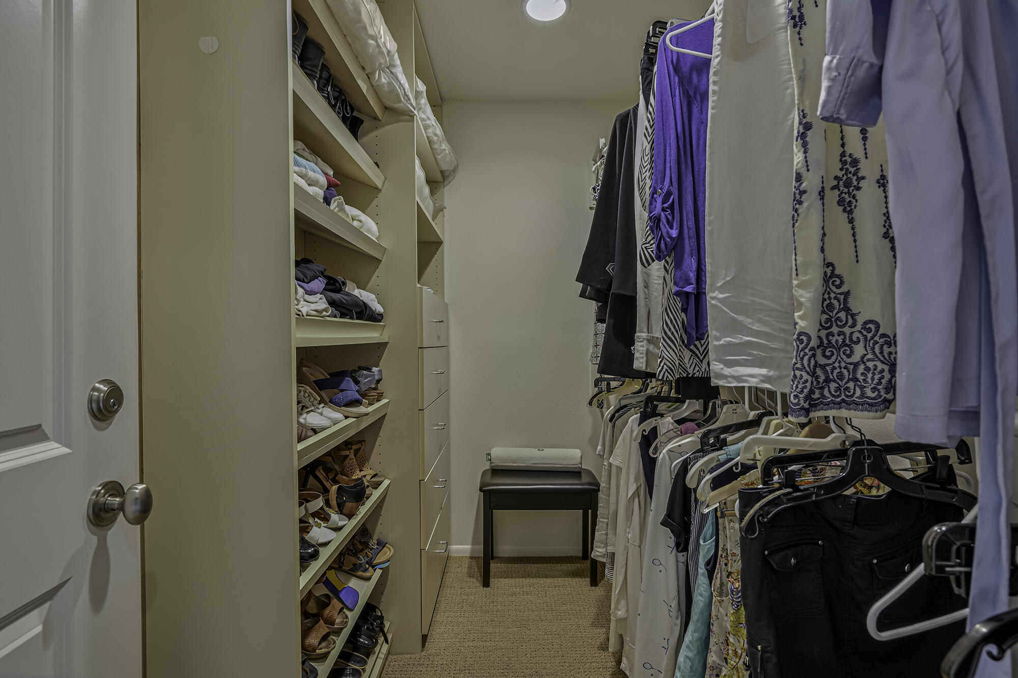 4 Stephens Court Rancho Mirage, CA 92270 - Photo 8 of 50 a view of walk in closet with clothes and shoes