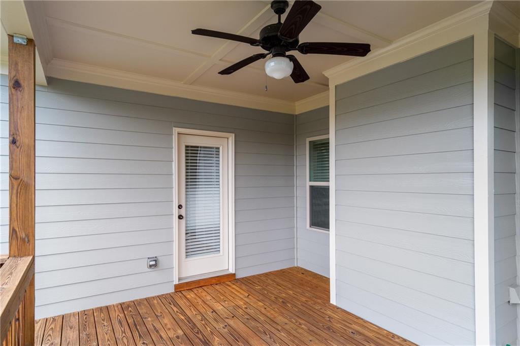 712 Fleeting Way Monroe, GA 30655 - Photo 27 of 29 an empty room with wooden floor closet and ceiling fan