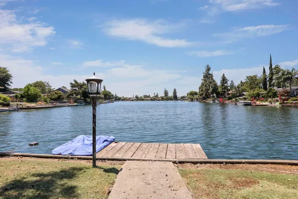 an outdoor space with swimming pool and furniture