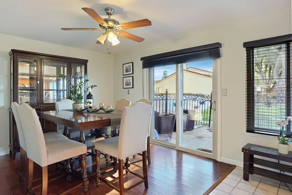 a dining room with furniture and window