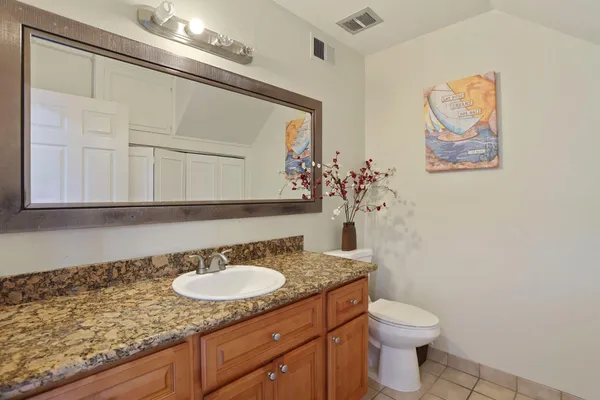 a view of washer and dryer with kitchen in the background