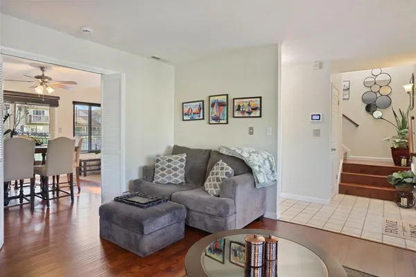 a view of a dining room with furniture window and wooden floor