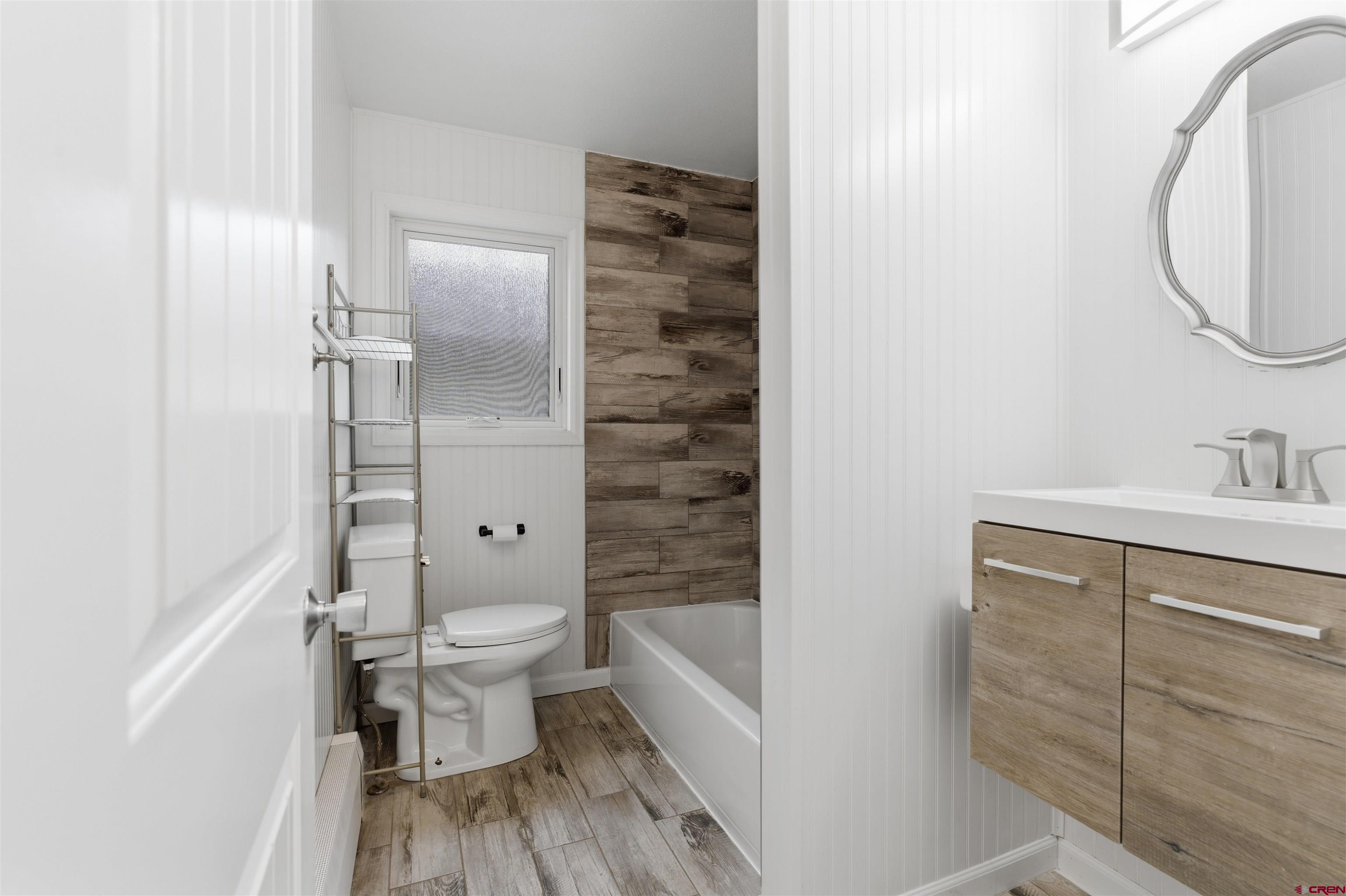 1029 Howard Street Delta, CO 81416 - Photo 11 of 17 a bathroom with a sink a toilet and shower