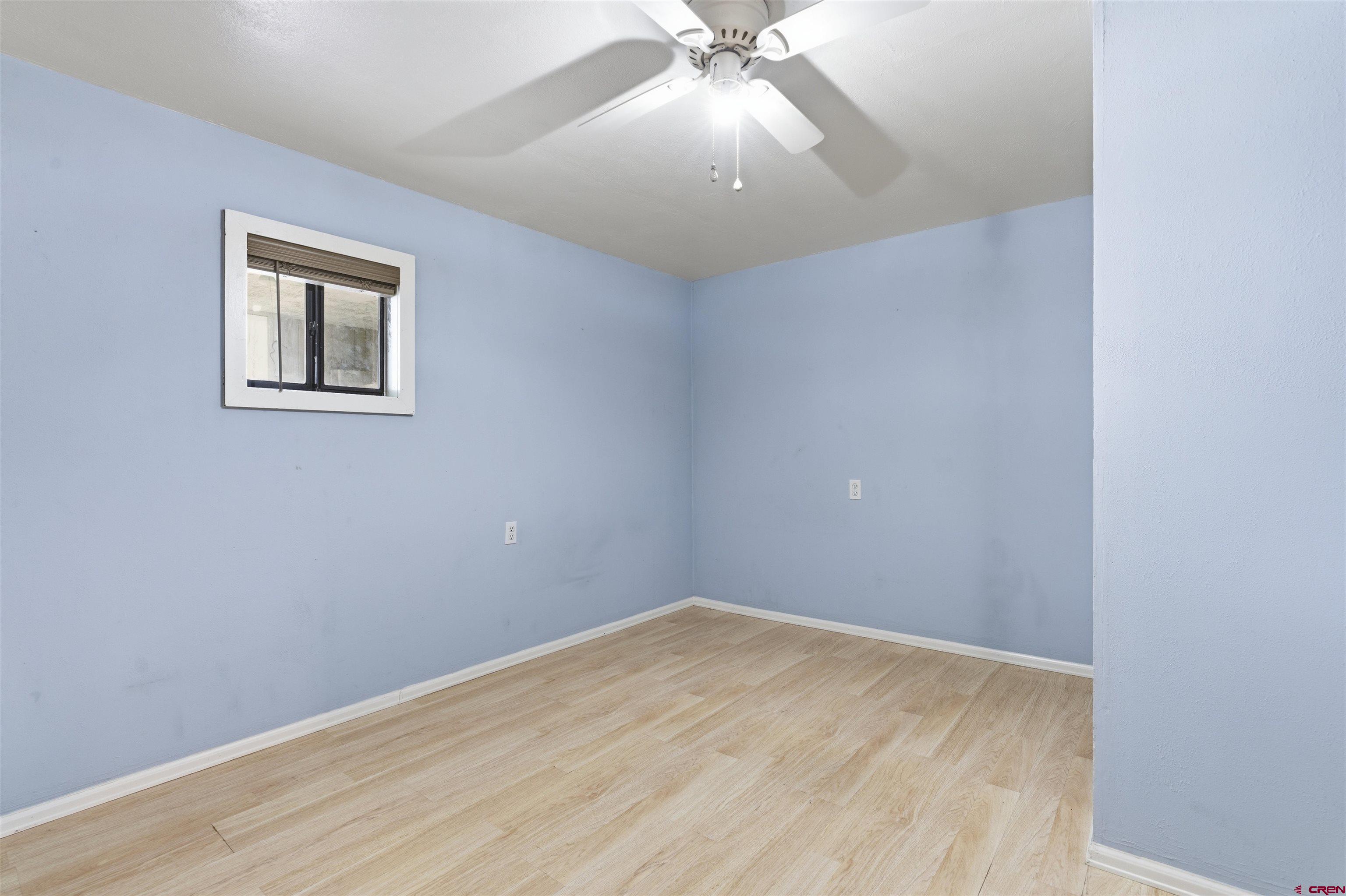1029 Howard Street Delta, CO 81416 - Photo 12 of 17 wooden floor in an empty room