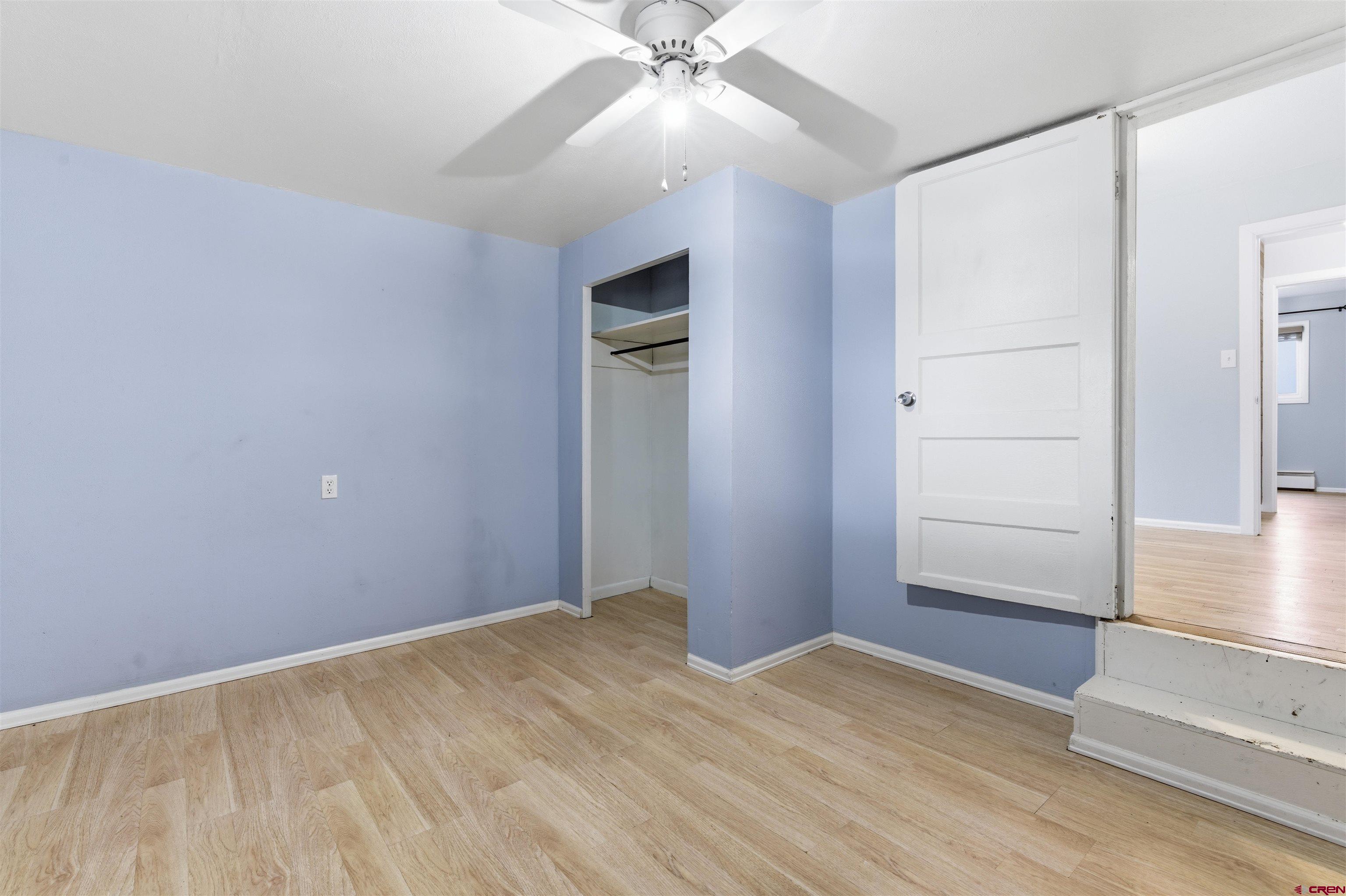 1029 Howard Street Delta, CO 81416 - Photo 13 of 17 wooden floor in an empty room