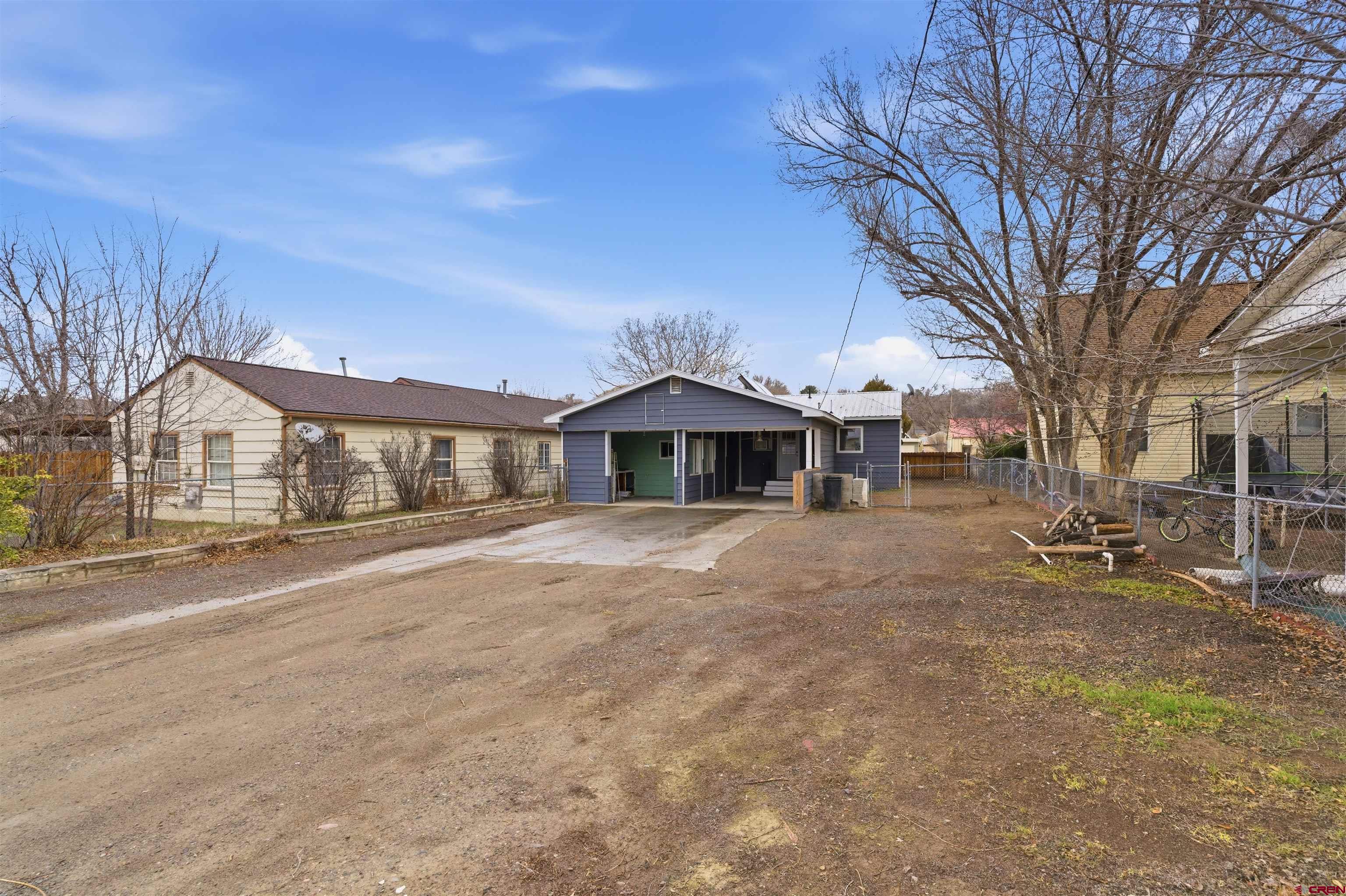 1029 Howard Street Delta, CO 81416 - Photo 16 of 17 a front view of a house with a yard
