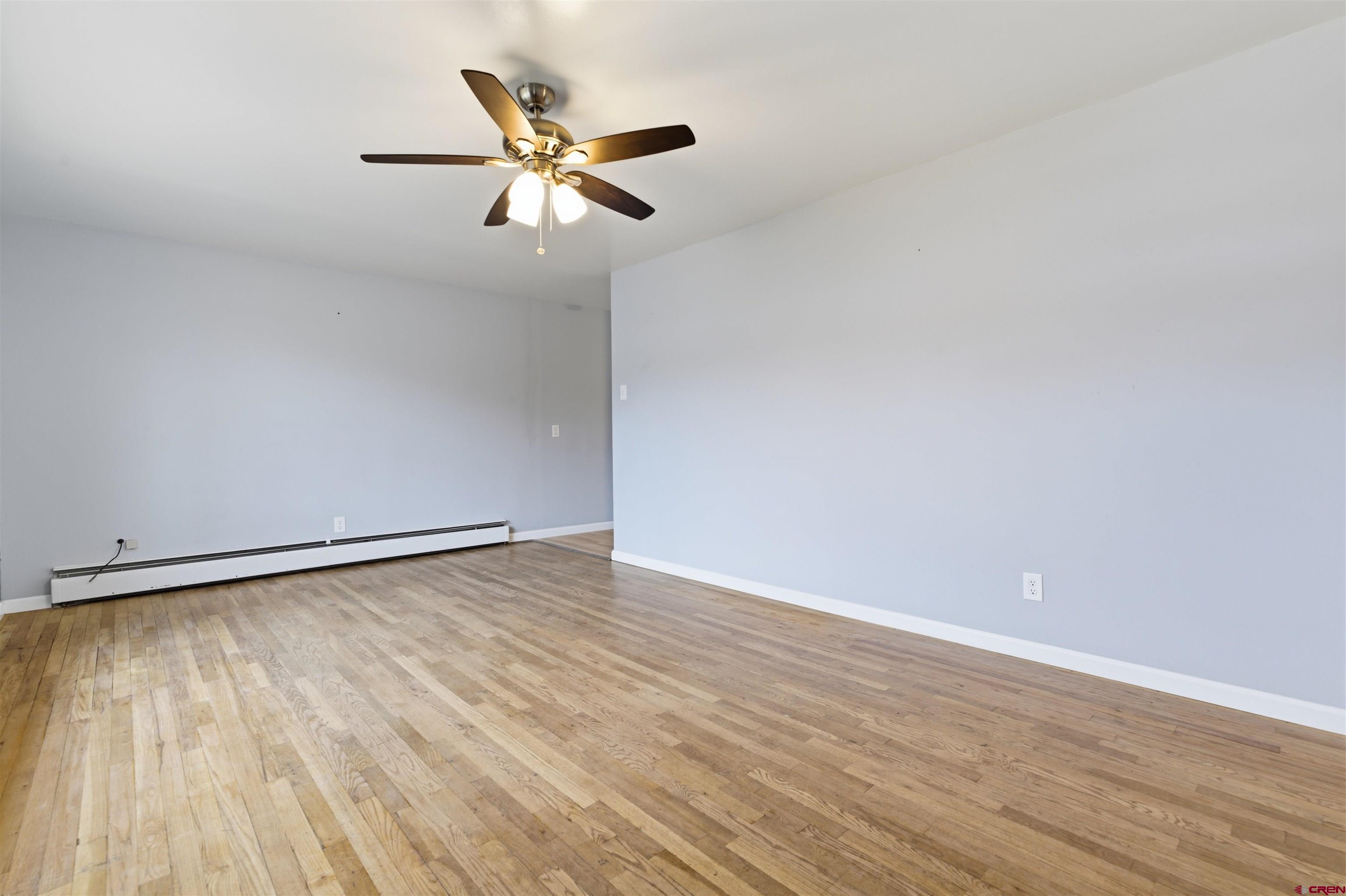 1029 Howard Street Delta, CO 81416 - Photo 3 of 17 wooden floor in an empty room