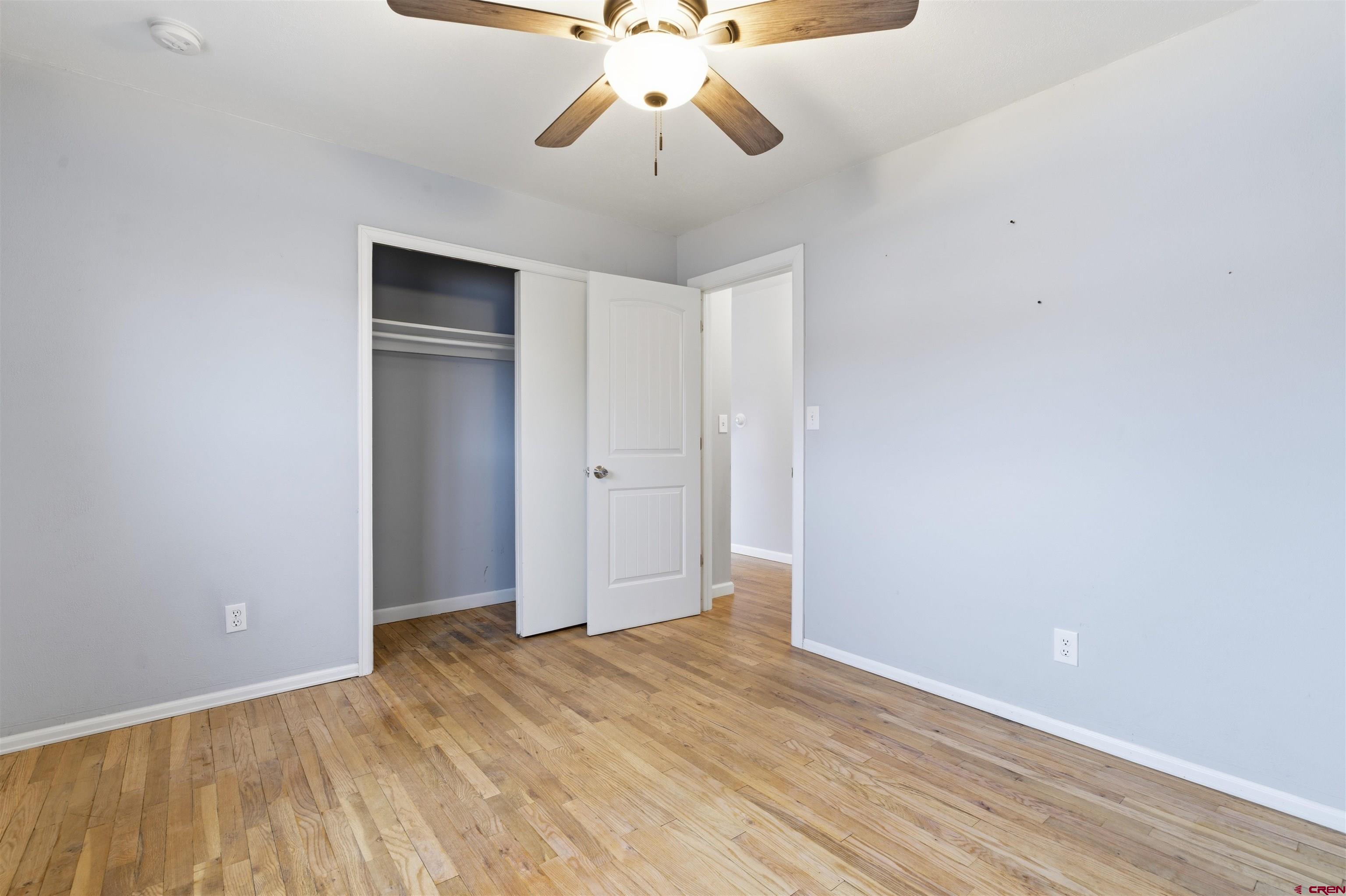 1029 Howard Street Delta, CO 81416 - Photo 8 of 17 a view of an empty room and chandelier fan