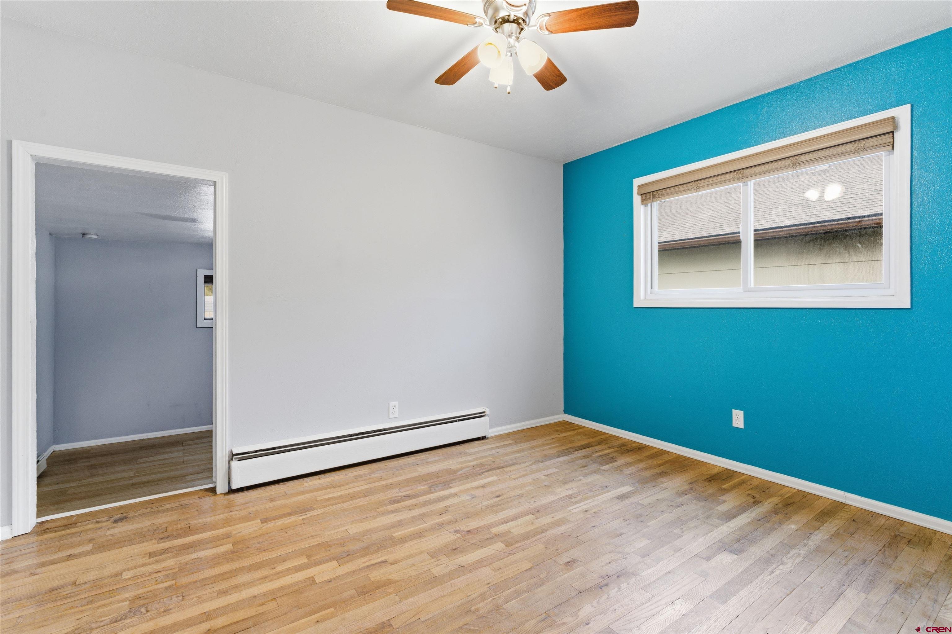 1029 Howard Street Delta, CO 81416 - Photo 9 of 17 a view of empty room with wooden floor