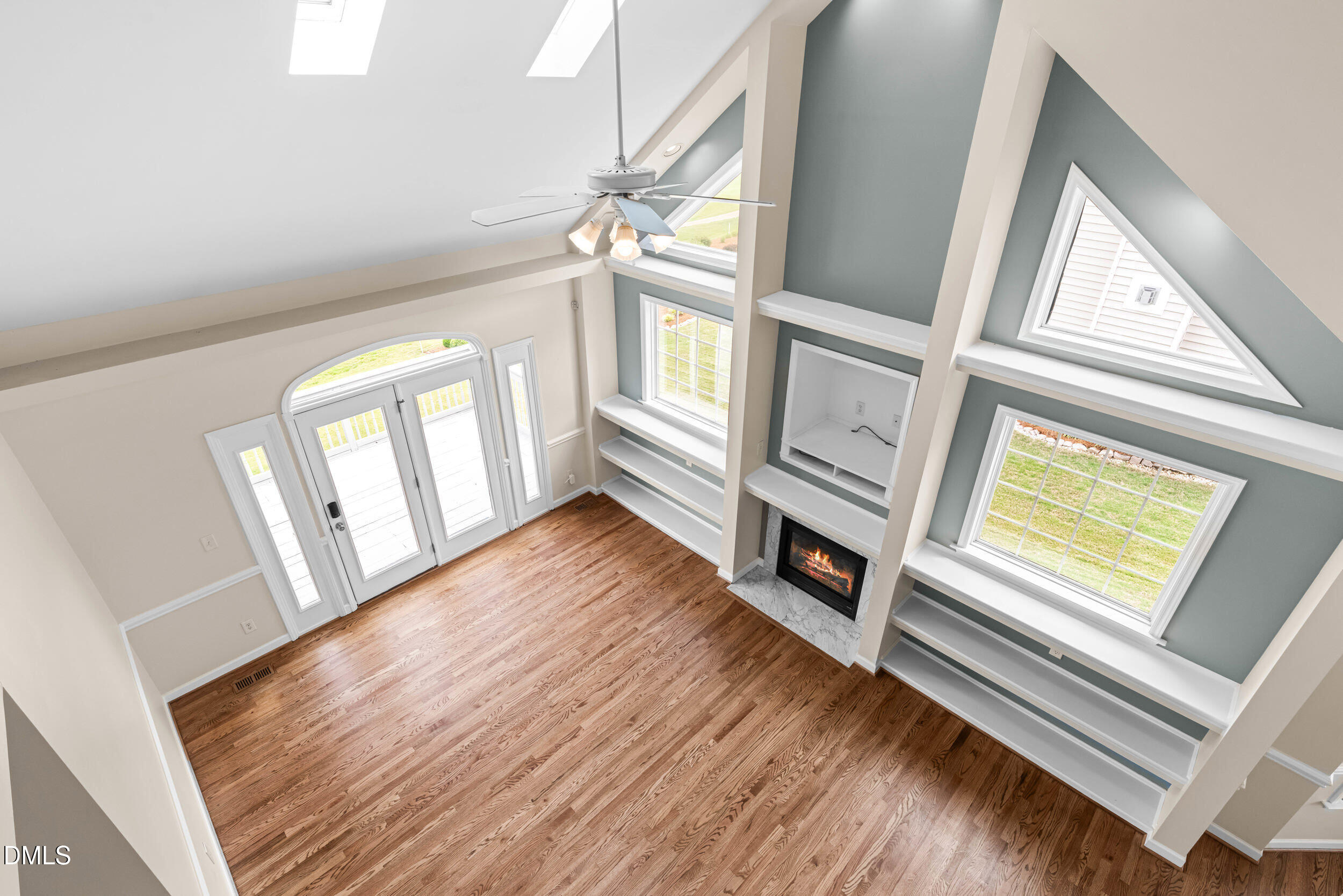 744 Seastone Street Raleigh, NC 27603 - Photo 40 of 53 a view of an empty room with wooden floor and a window