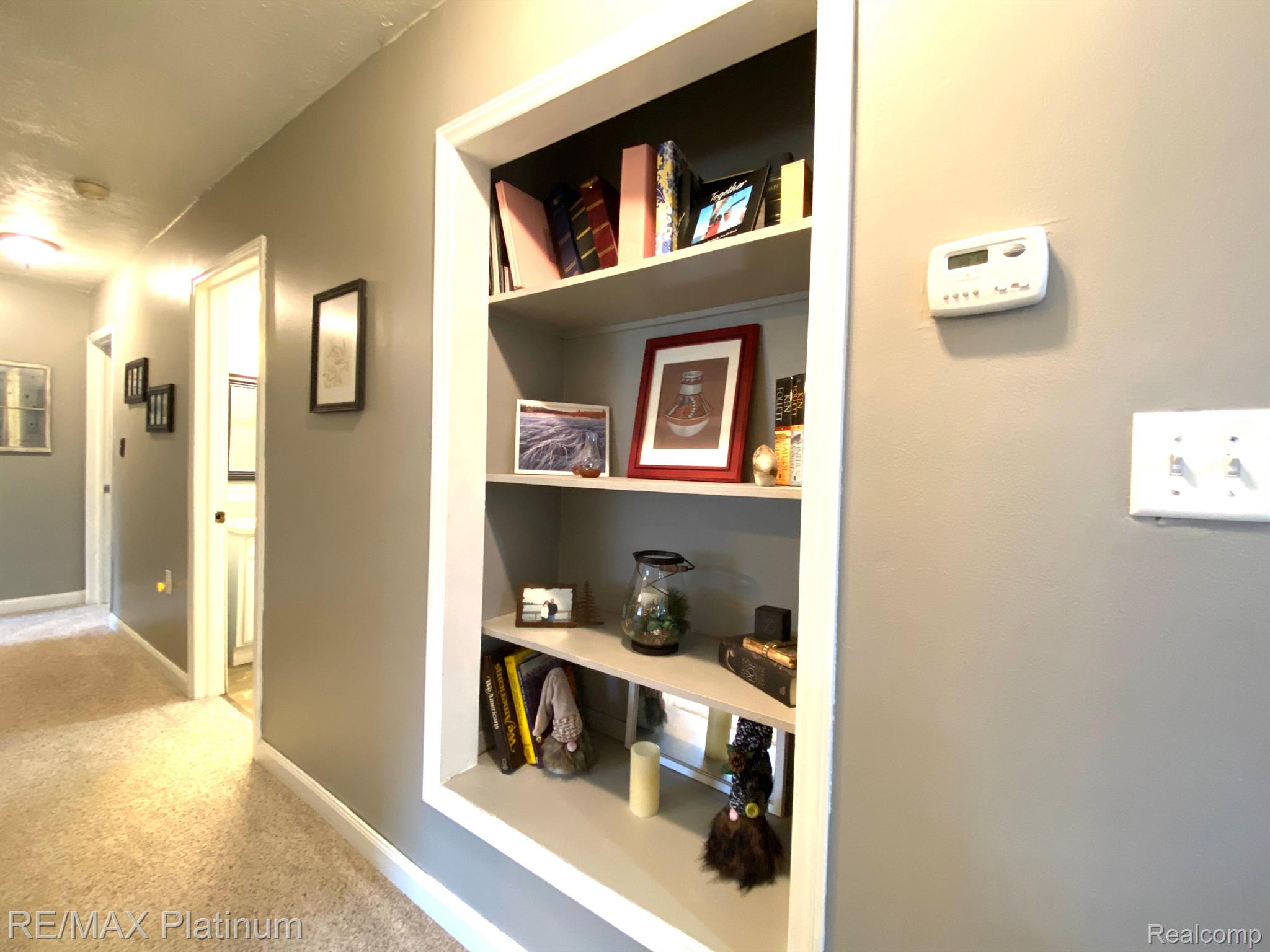 1017 North Latson Road Howell, MI 48843 - Photo 13 of 35 Built-in bookcases in hallway